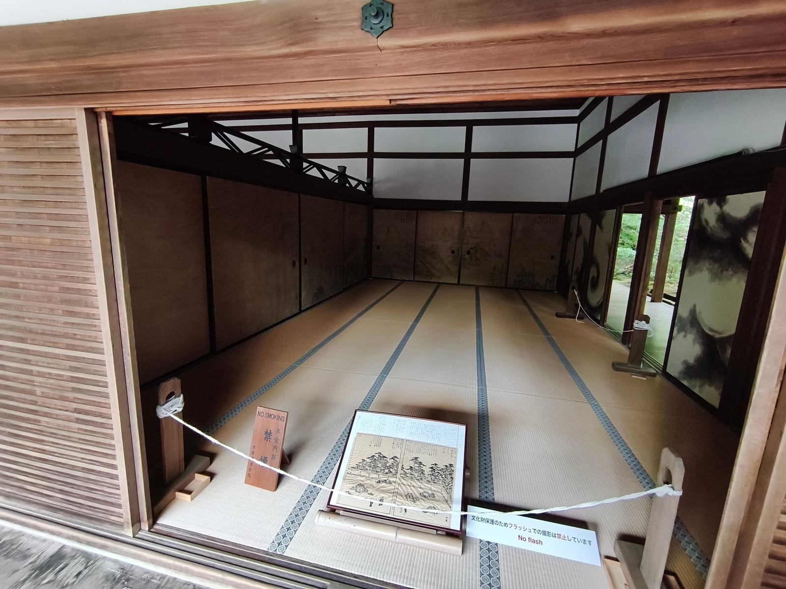 A tatami-floored room at Ryoan-ji with sliding fusuma doors painted in ink