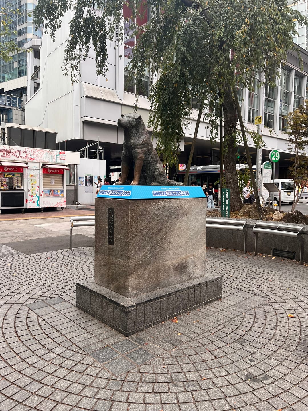 The bronze statue of Hachiko the Akita dog on its stone plinth outside Shibuya station