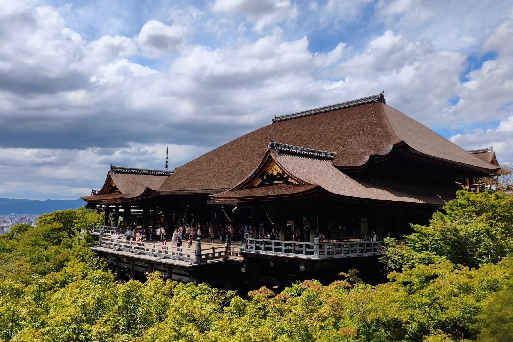 Kiyomizu-dera's wooden main hall on its stilts above the trees